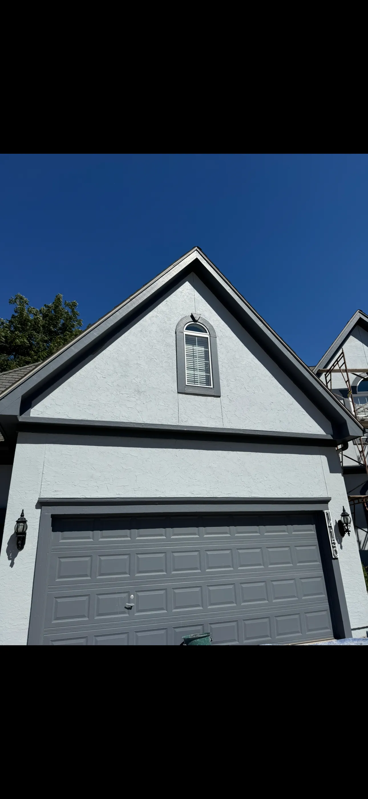 Cracked Stucco Exterior Gets a Full Skim Coat and Paint Refresh image
