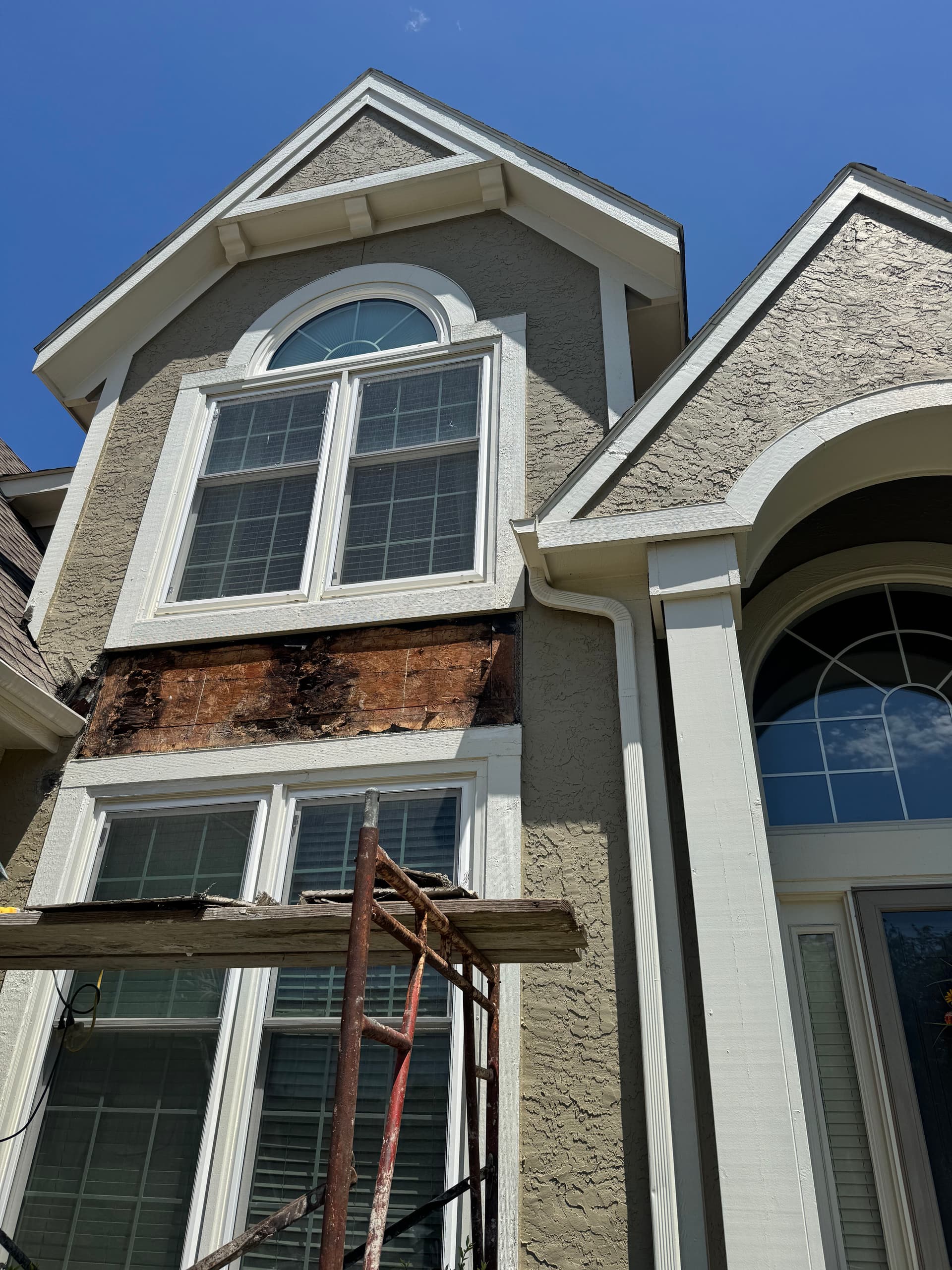 Wood Rot and Stucco Repair on a Two-Story Home Exterior image