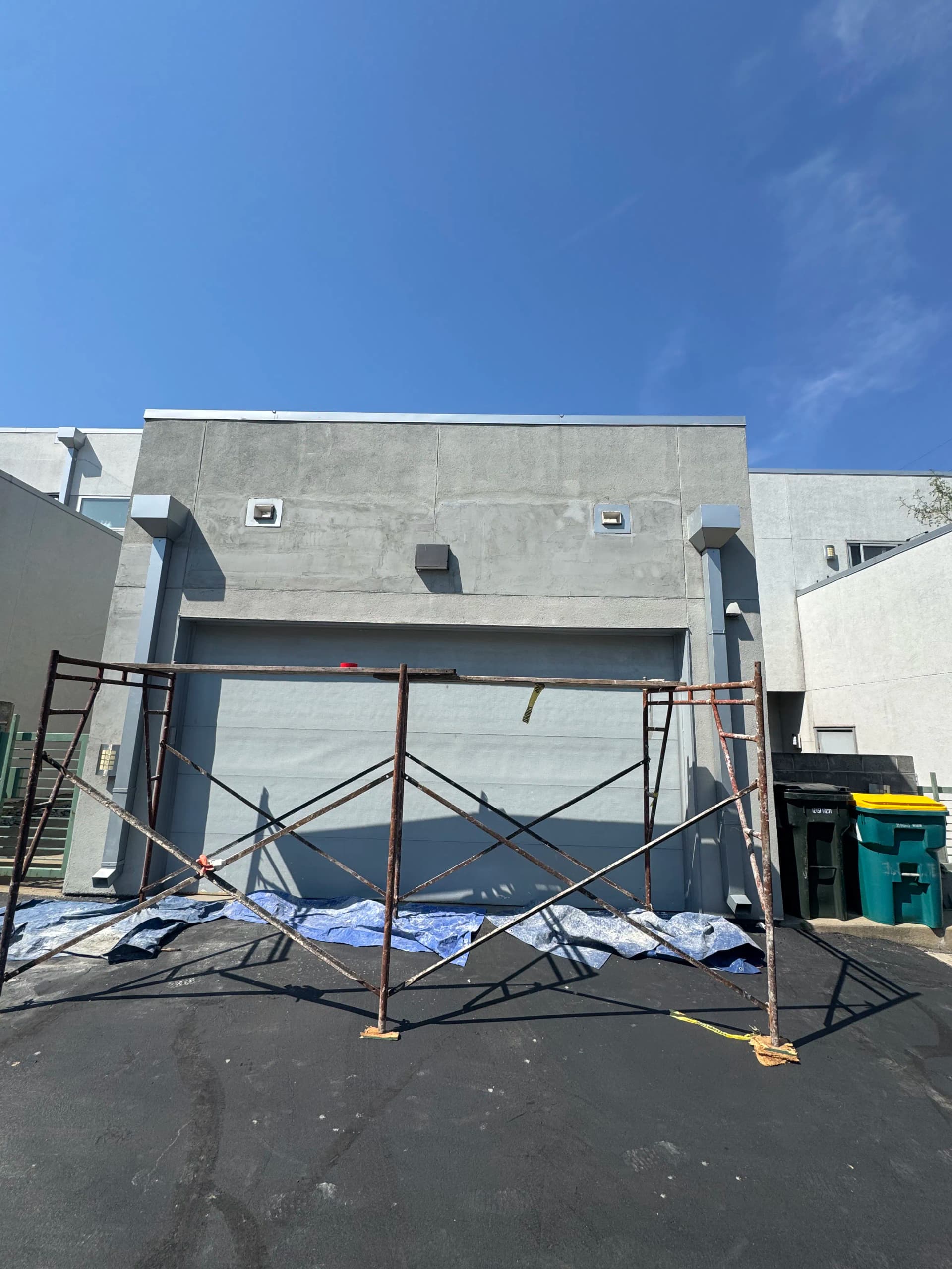 Stucco Crack Repair Above a Garage Door Done Right image